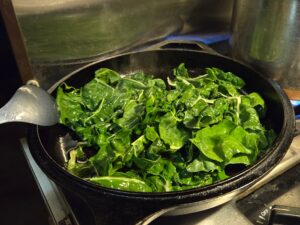 Cooking the chard in the van