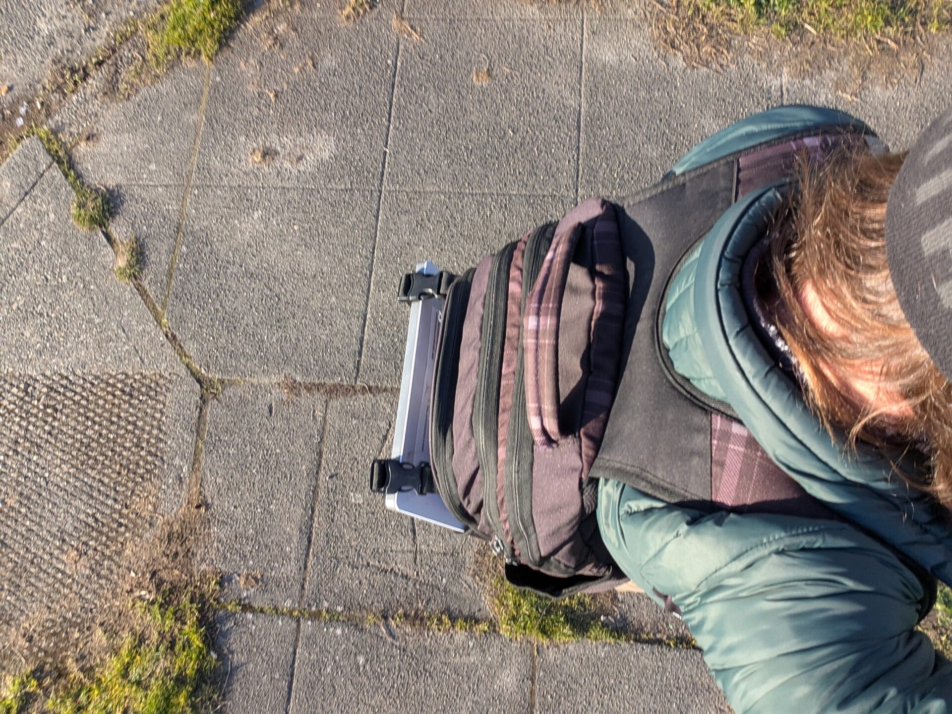 Walking through neighborhood with Starlink Mini in backpack