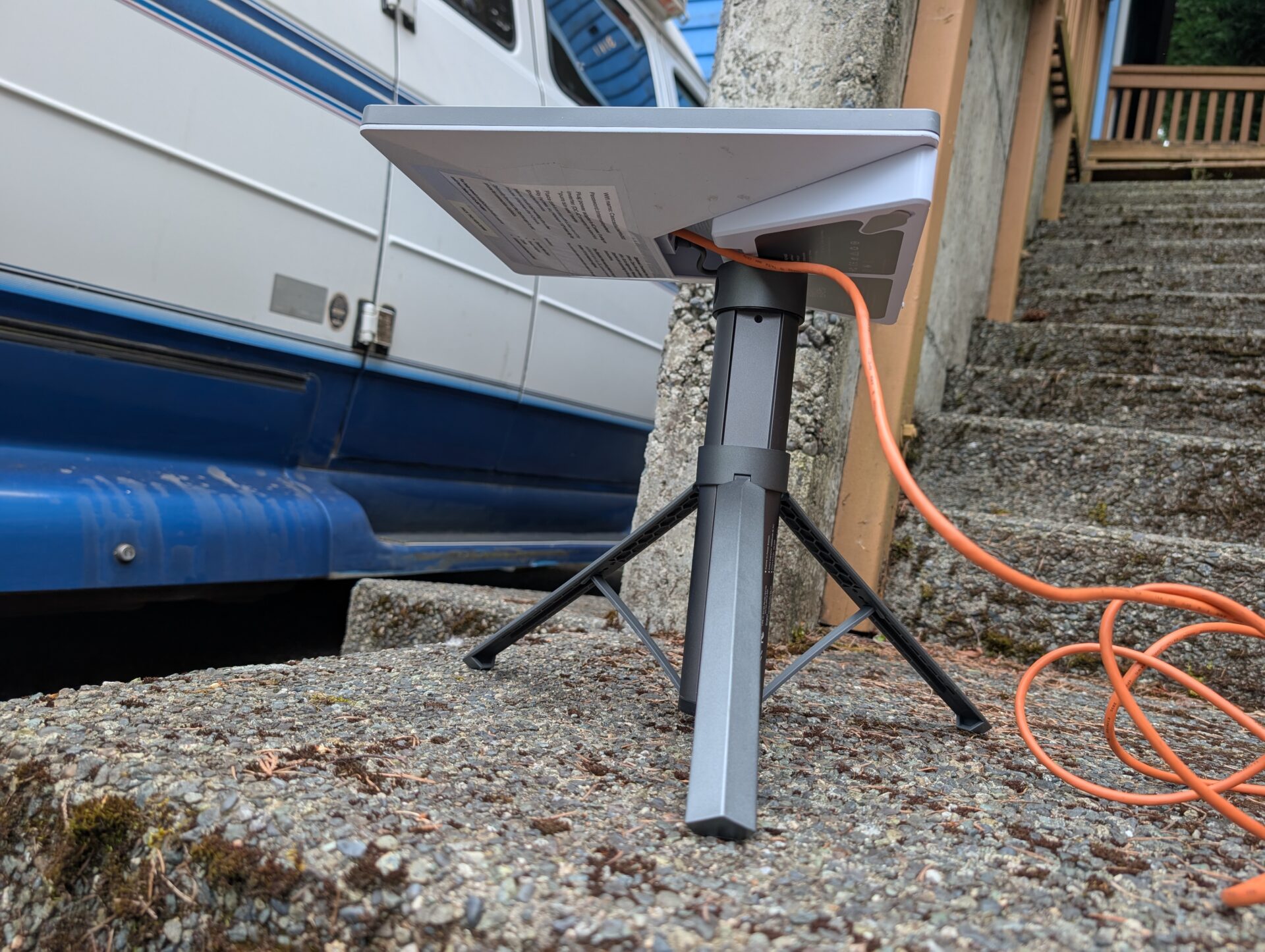 Underside view of Starlink Mini on the Orbynexa tripod with cable routing visible